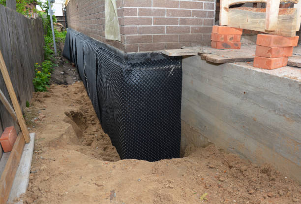 Happy homeowners after waterproofing job in Saint Elmo